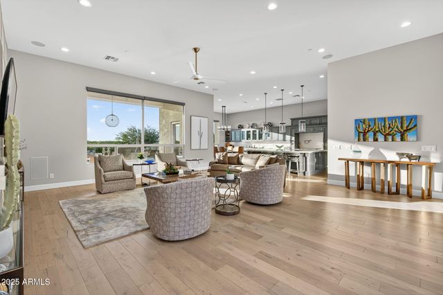 a living room with furniture a window and gym equipment