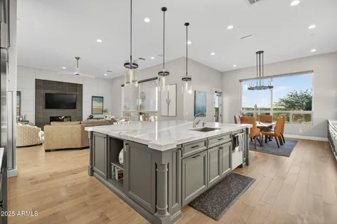 a living room with furniture a rug and a table
