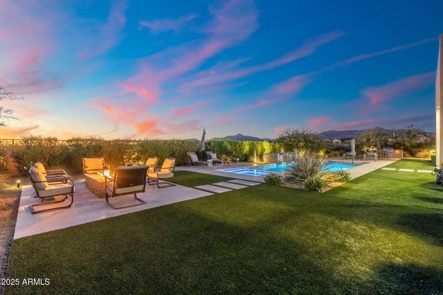 a view of a backyard with plants and trees