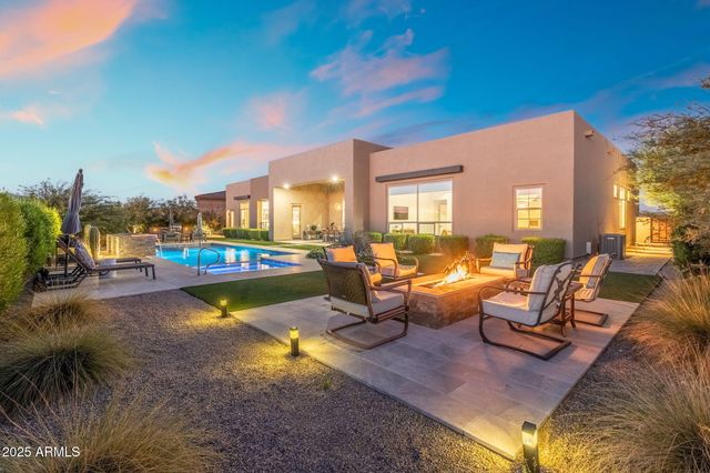a living room with fireplace furniture and a flat screen tv