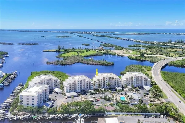 an aerial view of a house with a ocean view