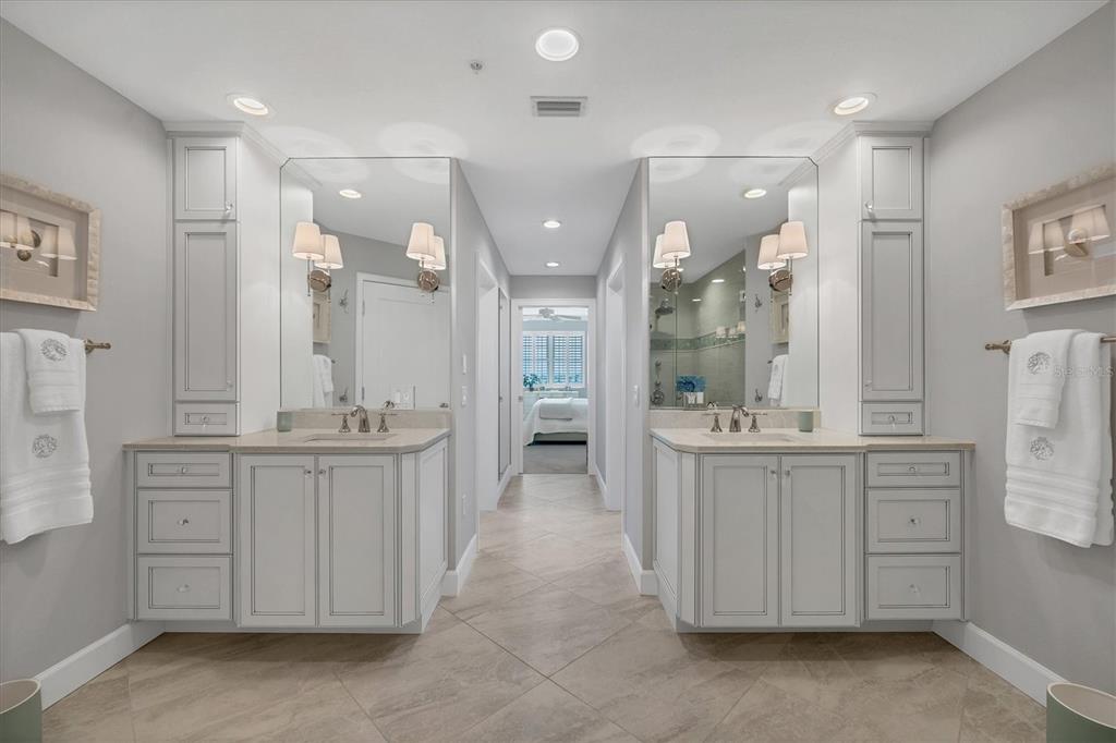 13213 Gasparilla Road, Unit B601 Placida, FL 33946 - Photo 19 of 36 a large bathroom with a large mirror vanity and shower