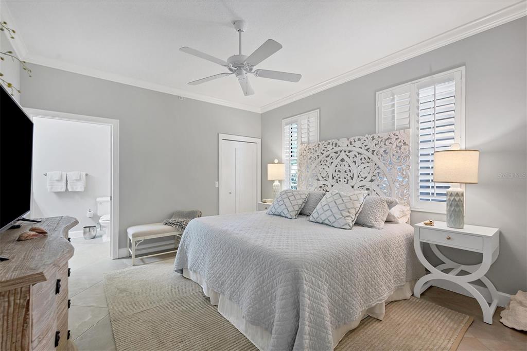 13213 Gasparilla Road, Unit B601 Placida, FL 33946 - Photo 20 of 36 a bedroom with a bed and chair