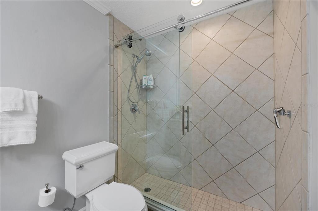 13213 Gasparilla Road, Unit B601 Placida, FL 33946 - Photo 23 of 36 a white toilet sitting next to a bathroom