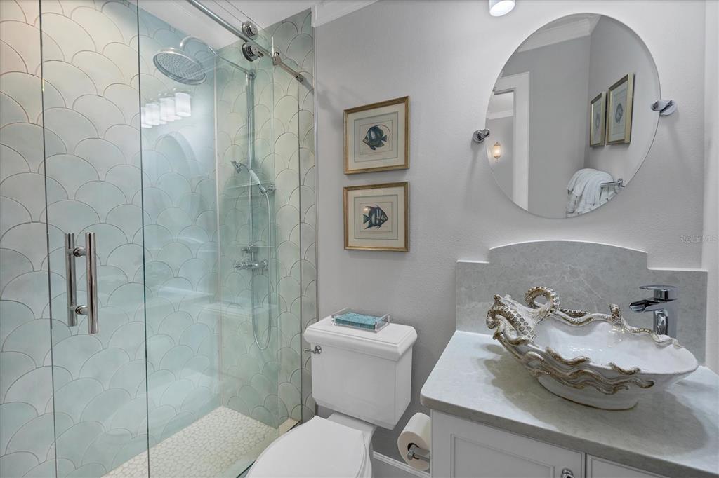 13213 Gasparilla Road, Unit B601 Placida, FL 33946 - Photo 26 of 36 a bathroom with a sink toilet and shower