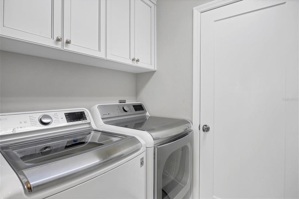 13213 Gasparilla Road, Unit B601 Placida, FL 33946 - Photo 27 of 36 a utility room with dryer and washer