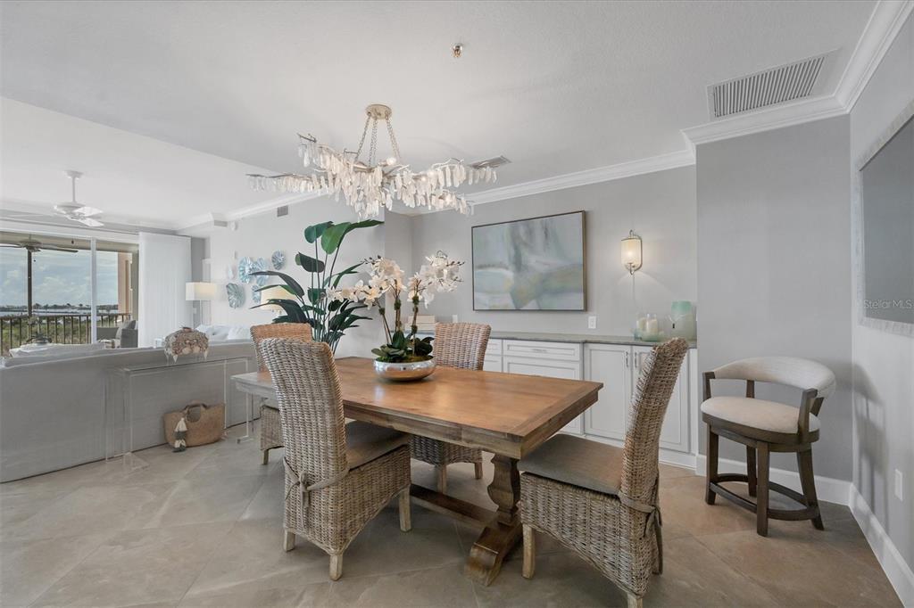 13213 Gasparilla Road, Unit B601 Placida, FL 33946 - Photo 6 of 36 a view of a dining room with furniture and wooden floor