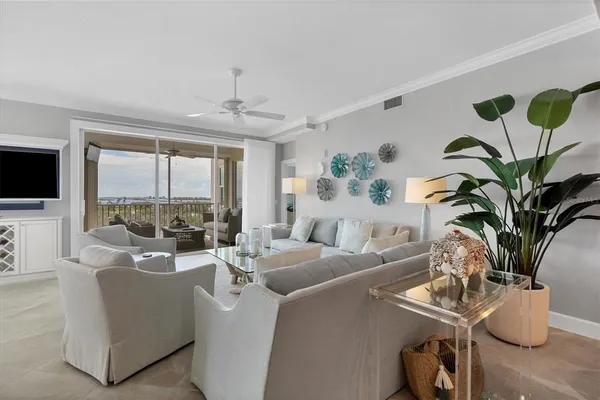 a living room with furniture and a large mirror