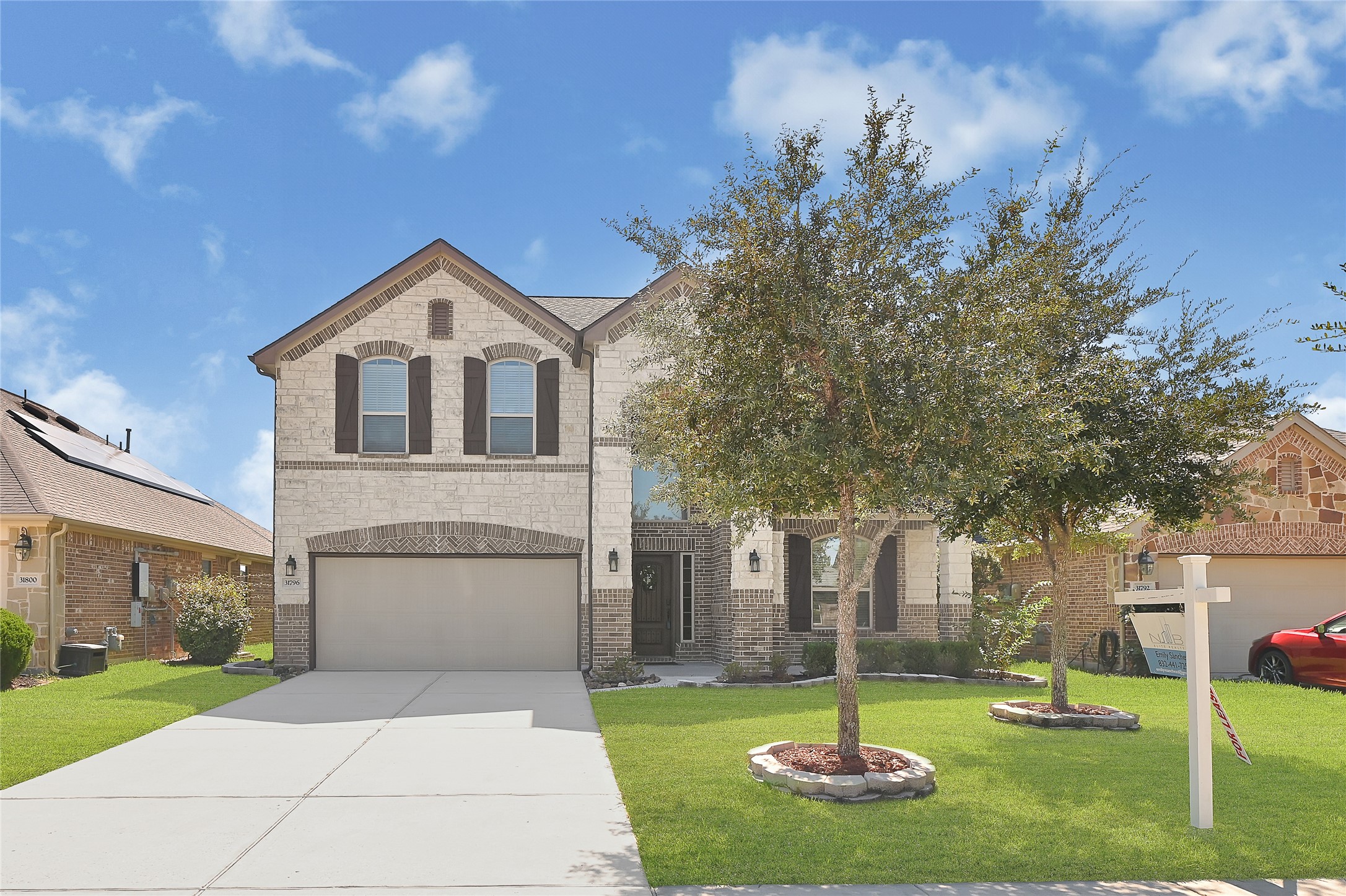 31796 Chapel Rock Lane Spring, TX 77386 - Photo 2 of 30 a front view of a house with a yard and garage