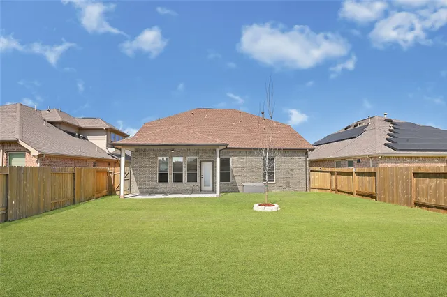 a view of a house with a big yard