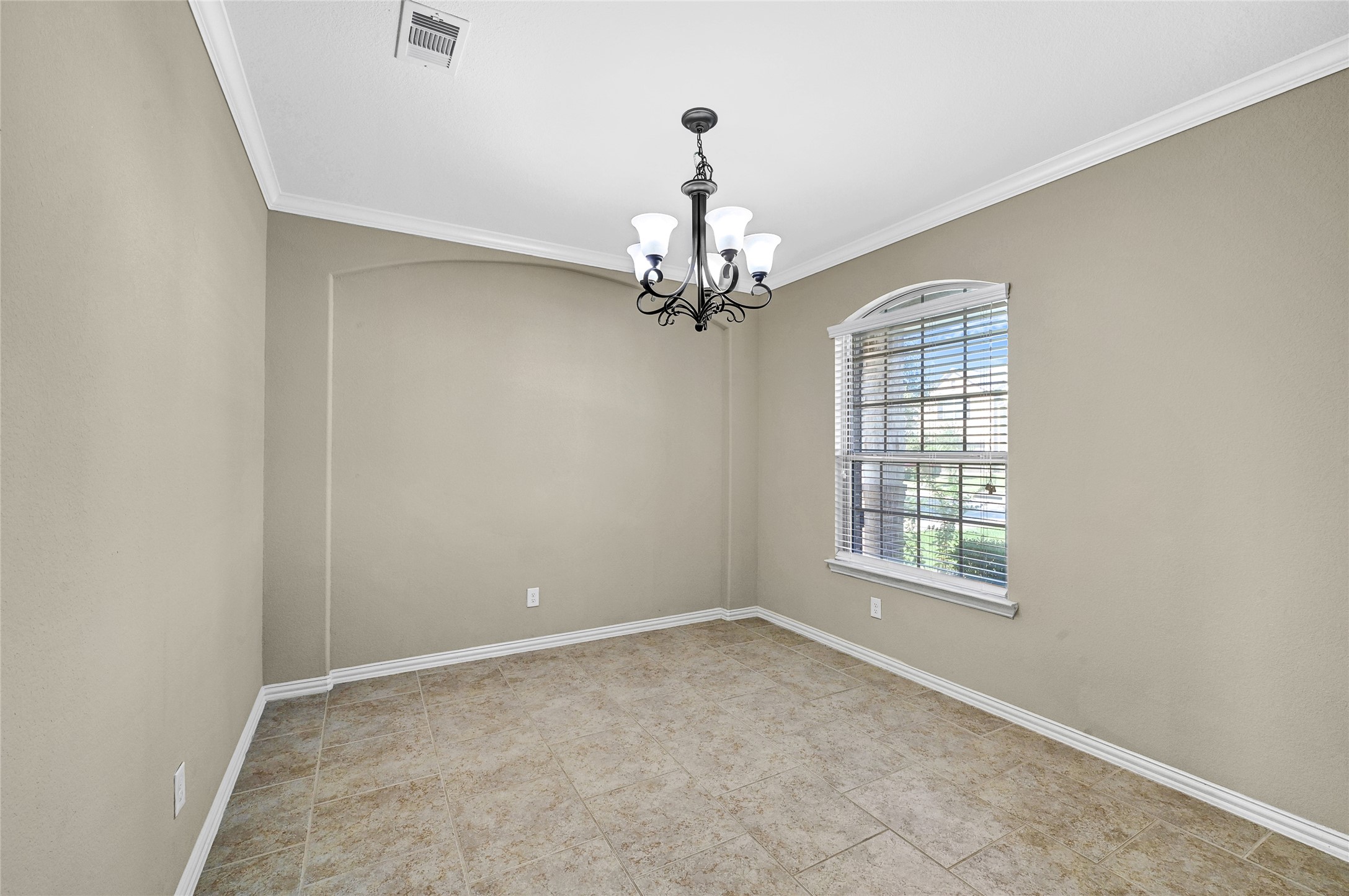 31796 Chapel Rock Lane Spring, TX 77386 - Photo 6 of 30 an empty room with windows and chandelier