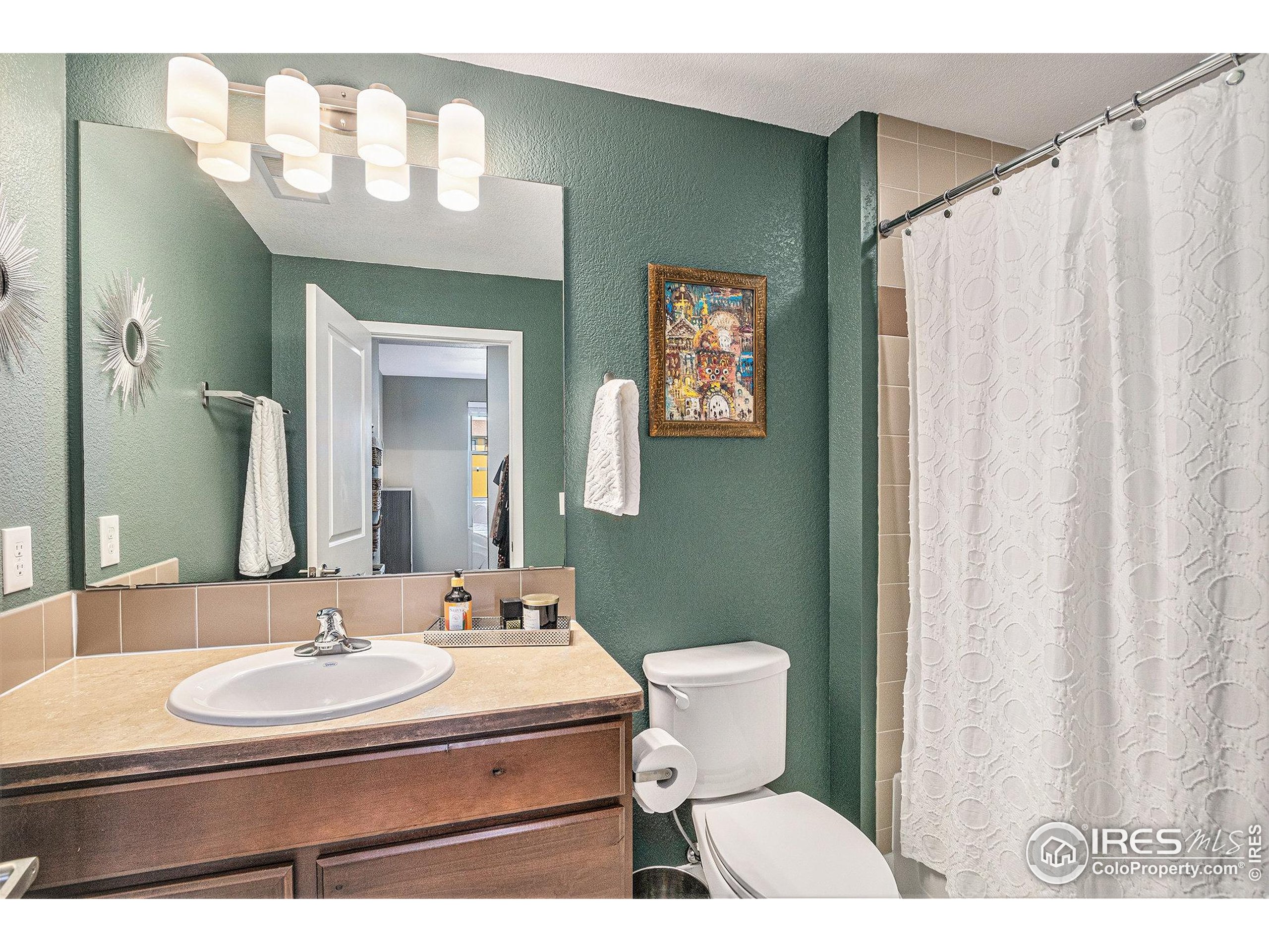 220 Willow Street, Unit 301 Fort Collins, CO 80524 - Photo 13 of 27 a bathroom with a sink and a mirror