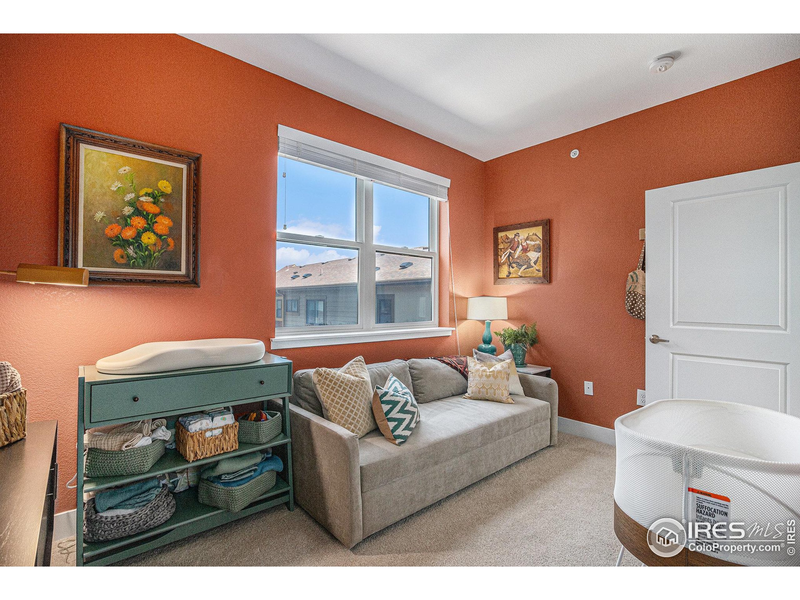 220 Willow Street, Unit 301 Fort Collins, CO 80524 - Photo 14 of 27 a living room with furniture and a window