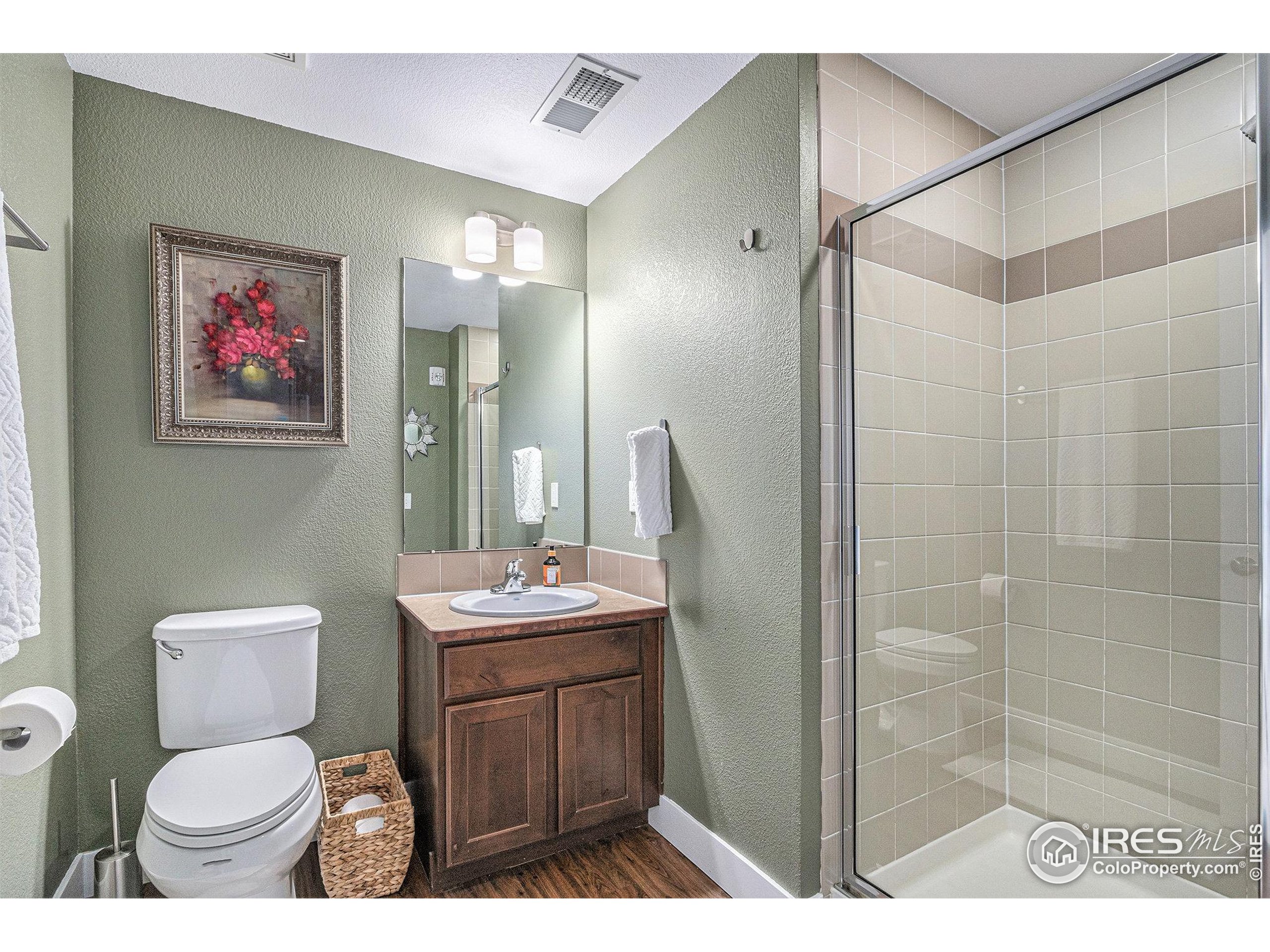 220 Willow Street, Unit 301 Fort Collins, CO 80524 - Photo 16 of 27 a bathroom with a toilet sink and shower