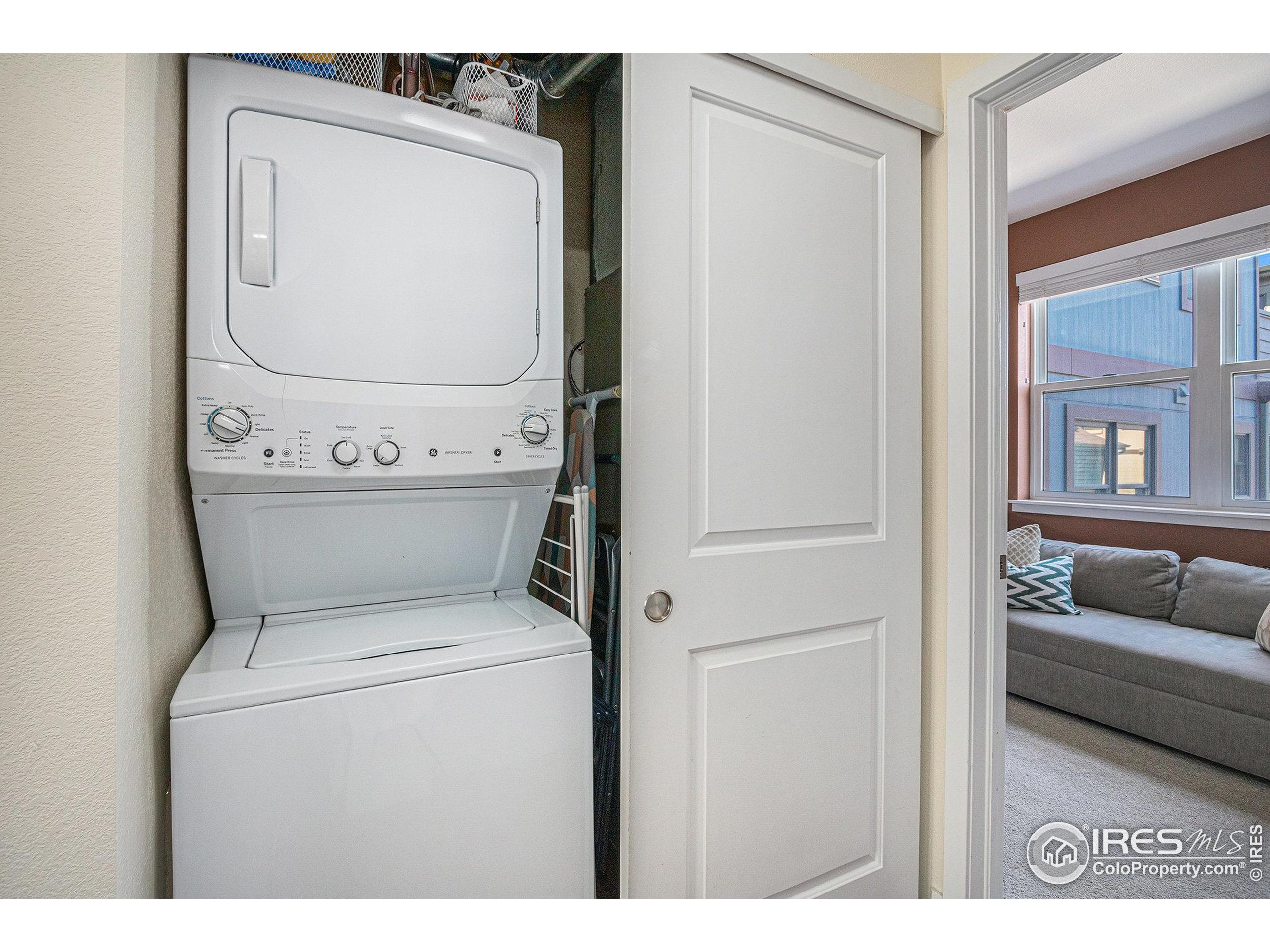220 Willow Street, Unit 301 Fort Collins, CO 80524 - Photo 17 of 27 a utility room with dryer and washer