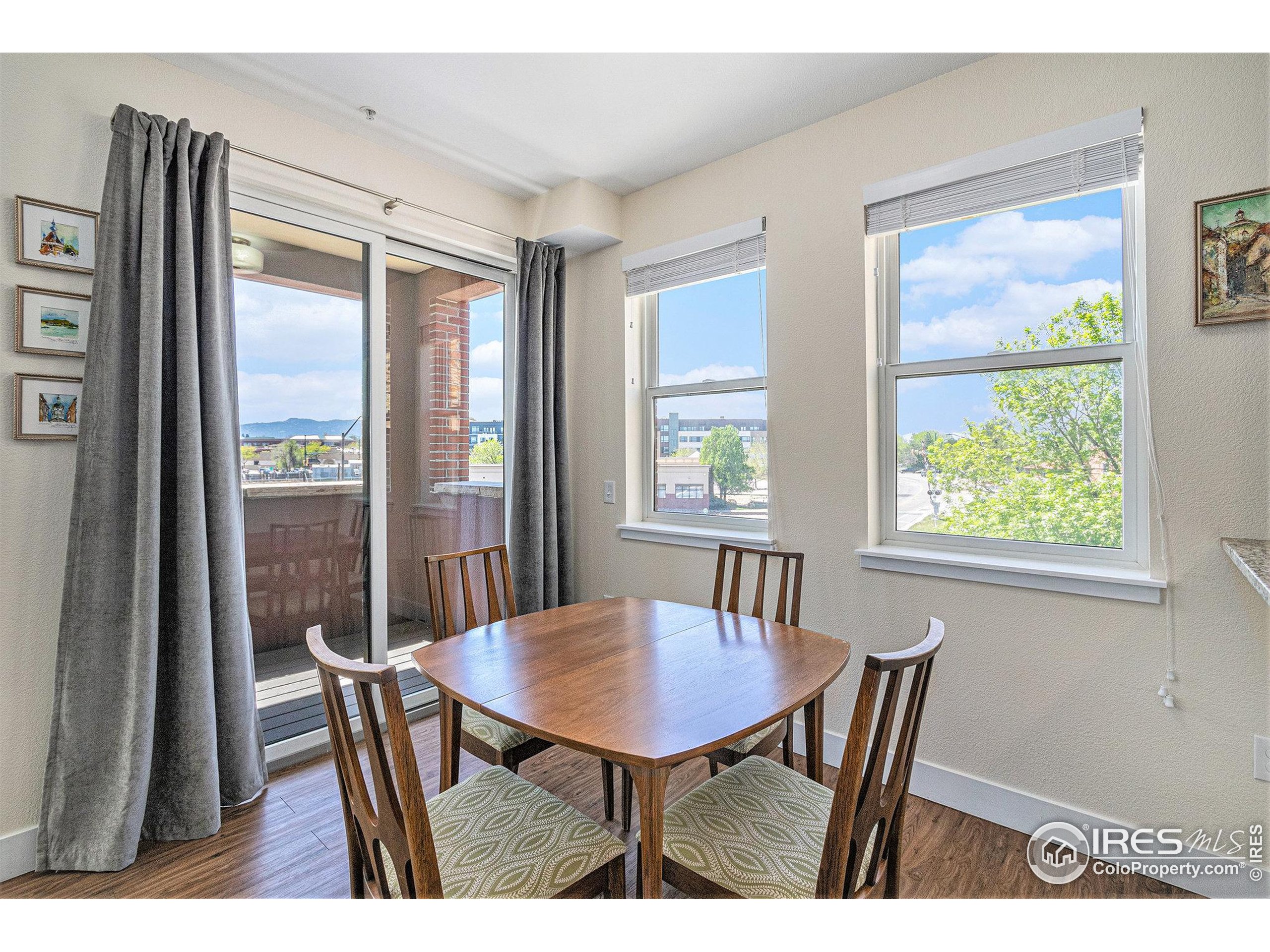 220 Willow Street, Unit 301 Fort Collins, CO 80524 - Photo 2 of 27 a view of a dining room with furniture window and outside view