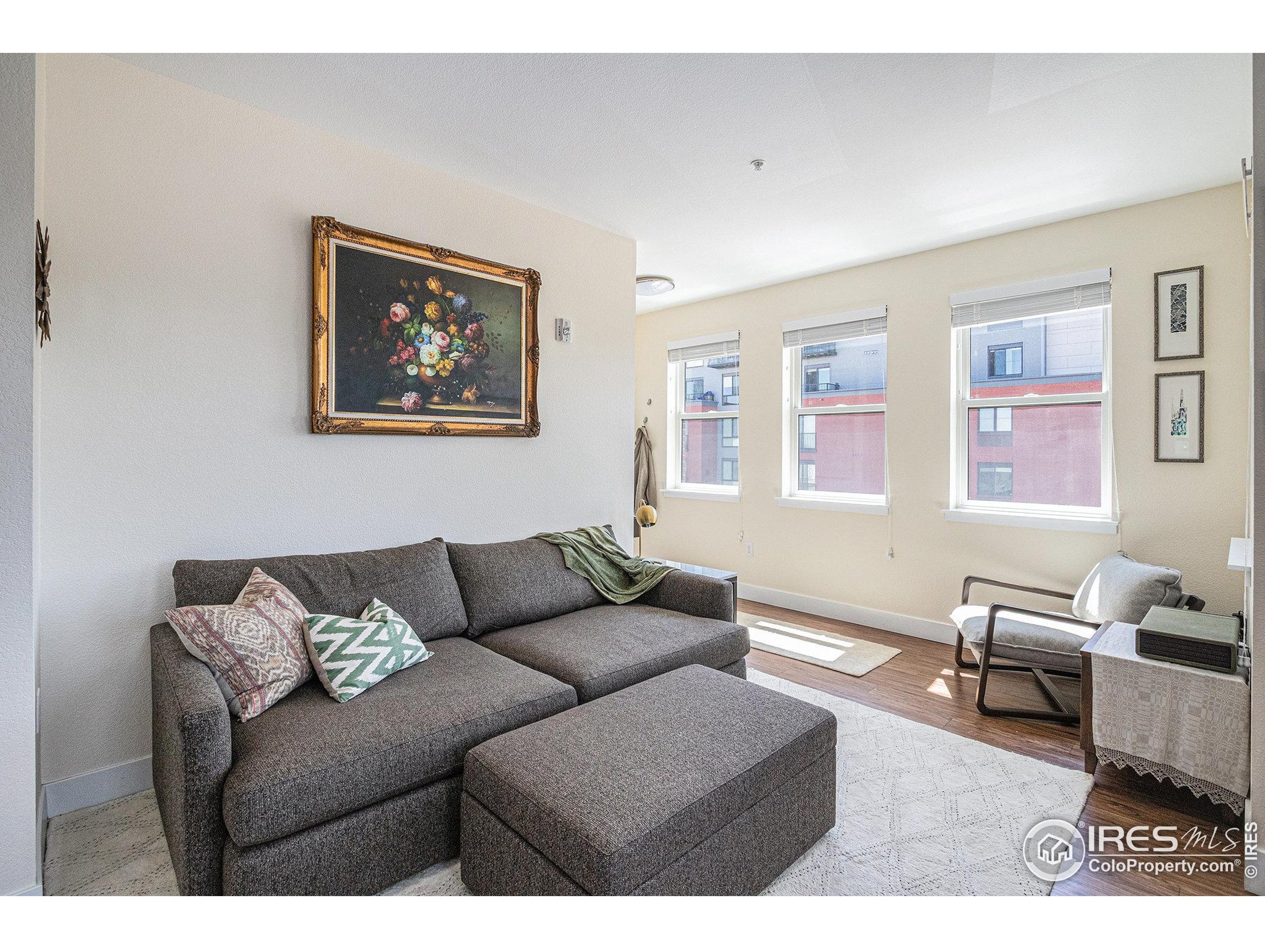 220 Willow Street, Unit 301 Fort Collins, CO 80524 - Photo 8 of 27 a living room with furniture and a window