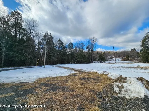 a kitchen with stainless steel appliances kitchen island granite countertop a refrigerator and a wooden cabinets