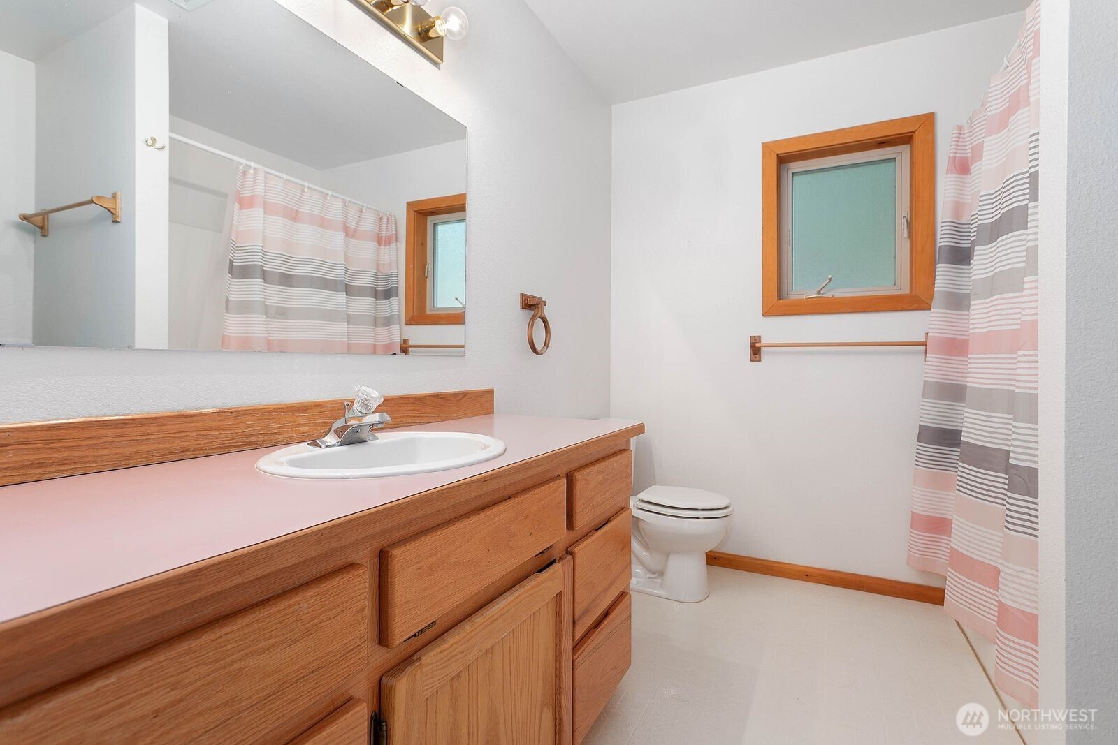 7132 St Helen's Place Deming, WA 98244 - Photo 13 of 35 a bathroom with a granite countertop sink toilet and mirror