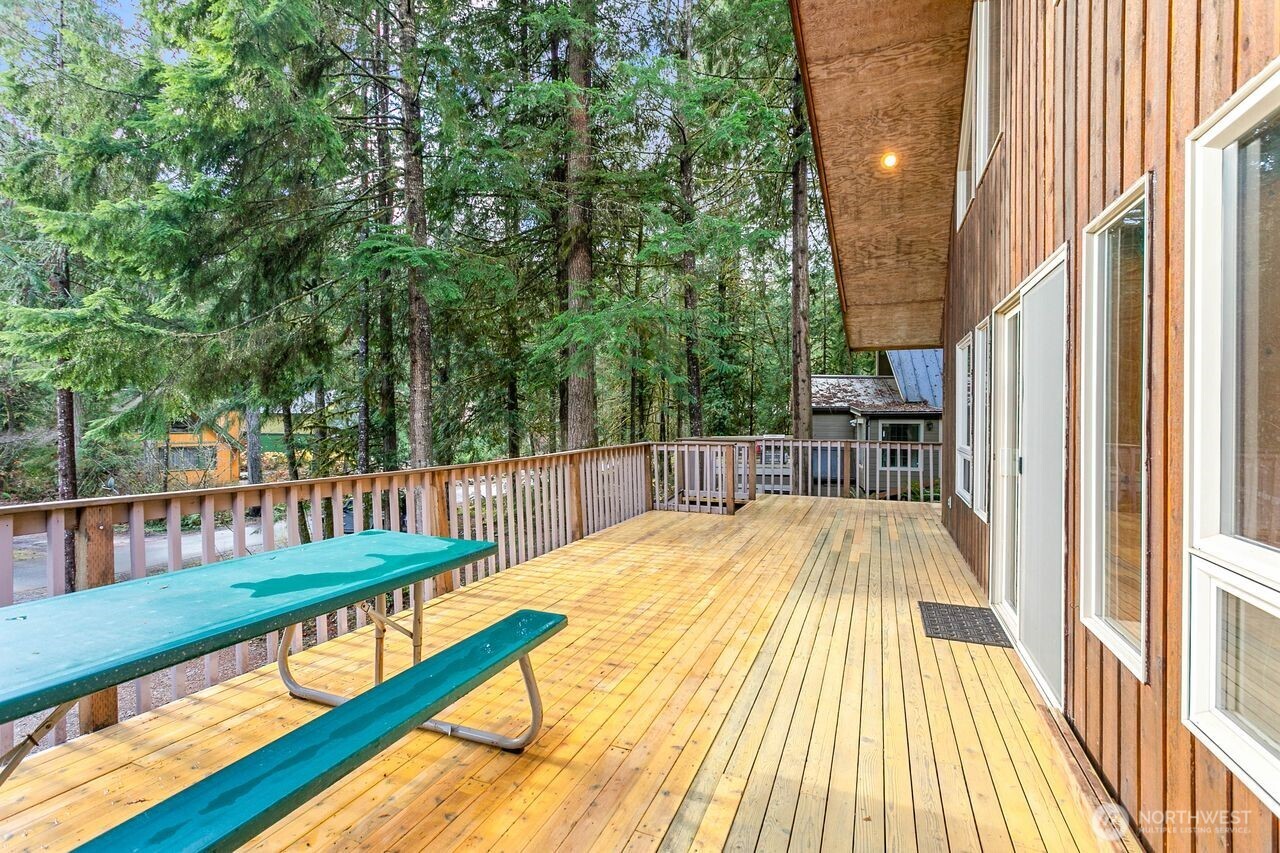 7132 St Helen's Place Deming, WA 98244 - Photo 26 of 35 a view of swimming pool with a patio and wooden floor