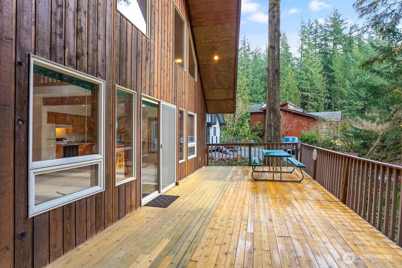 7132 St Helen's Place Deming, WA 98244 - Photo 27 of 35 a view of balcony with two chairs and wooden fence