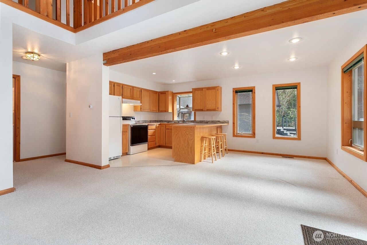 7132 St Helen's Place Deming, WA 98244 - Photo 7 of 35 a view of a kitchen with a sink and a refrigerator