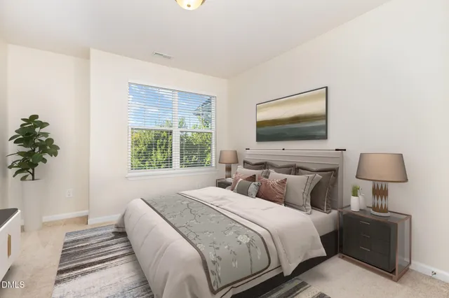 a bedroom with bed and flat screen tv