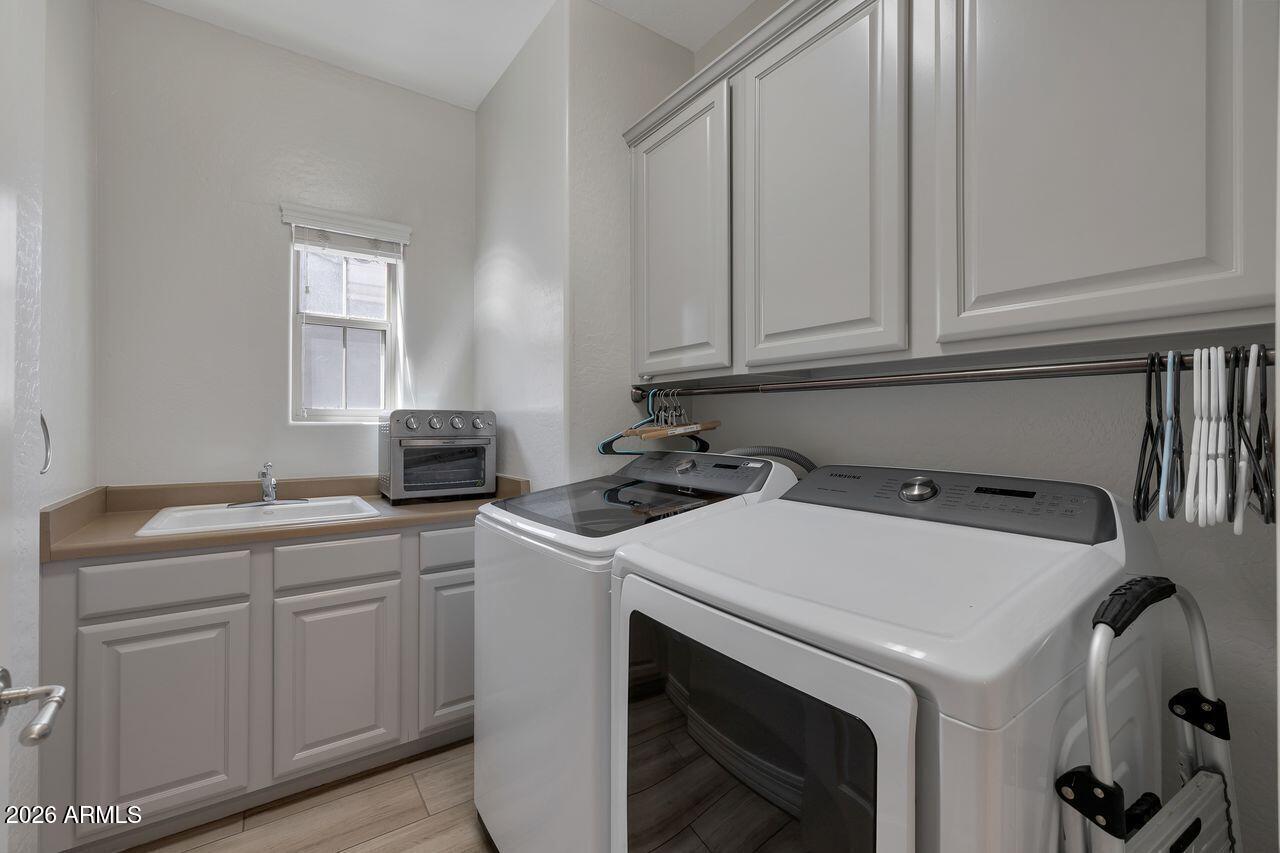 3935 East Rough Rider Road, Unit 1179 Phoenix, AZ 85050 - Photo 33 of 54 Full laundry with sink