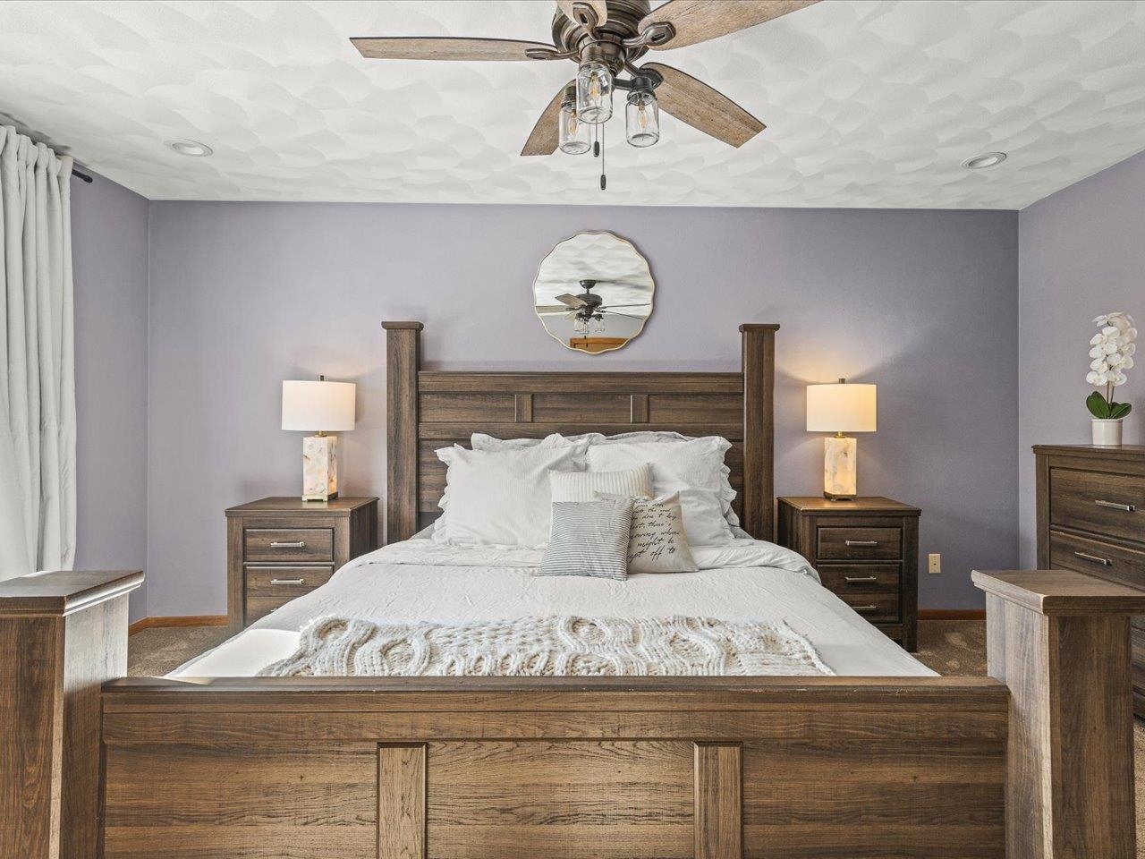 8629 Perth Lane Caledonia, IL 61011 - Photo 27 of 50 a bedroom with a bed and a chandelier