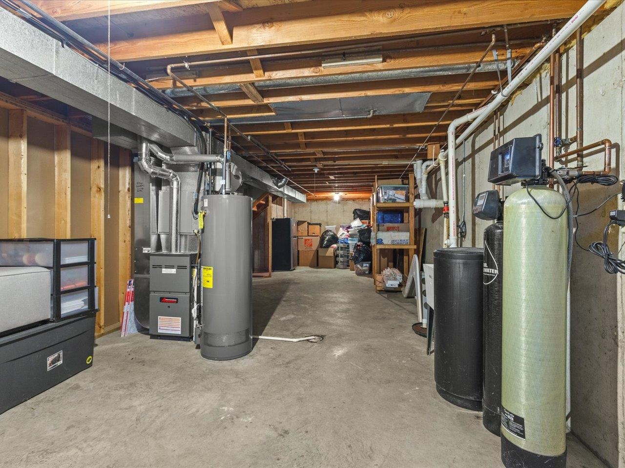 8629 Perth Lane Caledonia, IL 61011 - Photo 38 of 50 a view of water heater room with refrigerator