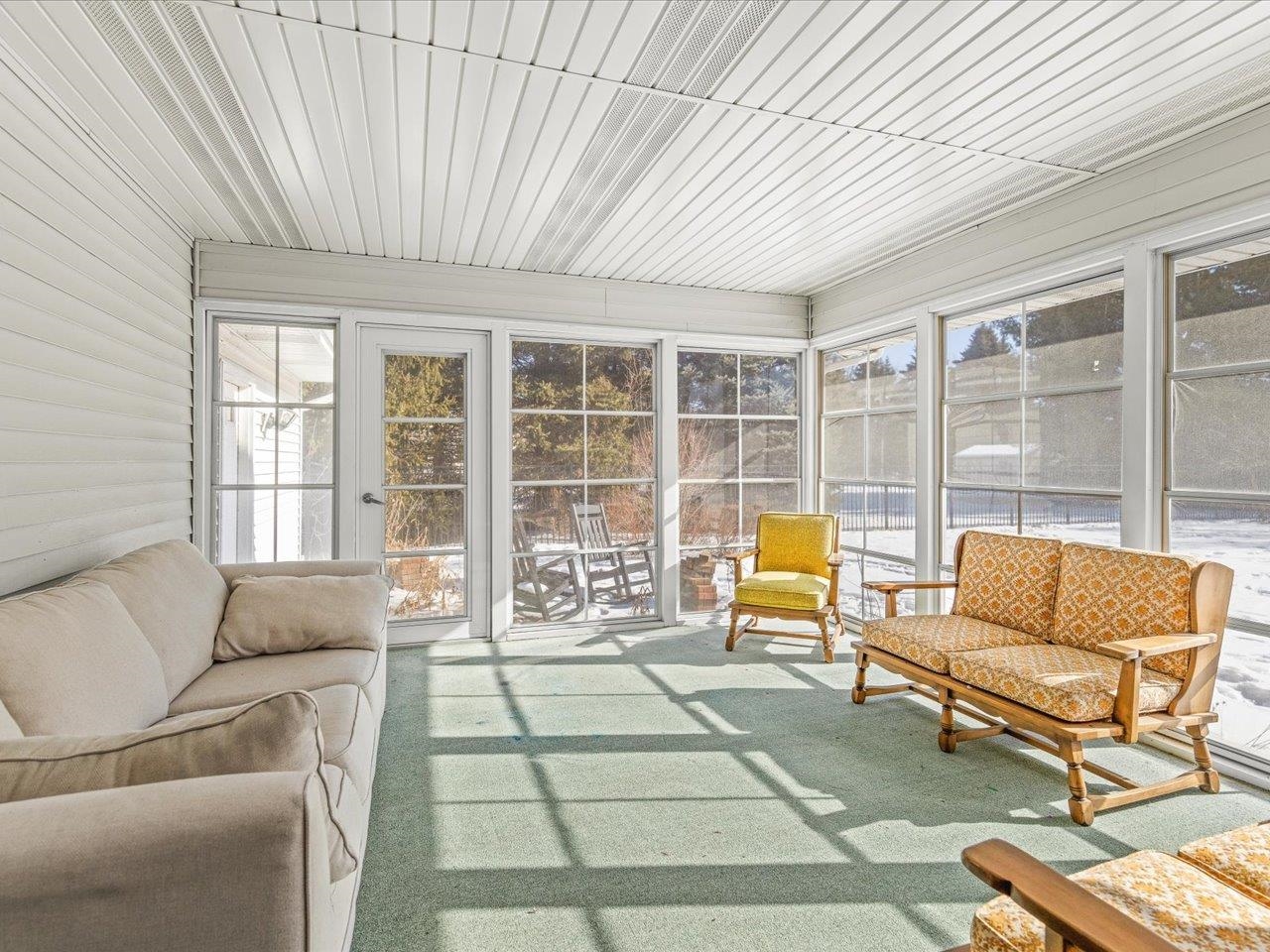 8629 Perth Lane Caledonia, IL 61011 - Photo 44 of 50 a living room with furniture and a floor to ceiling window
