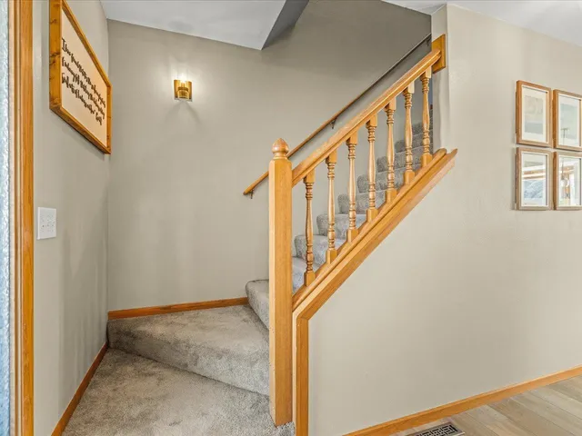 a bathroom with a sink a toilet and a large mirror