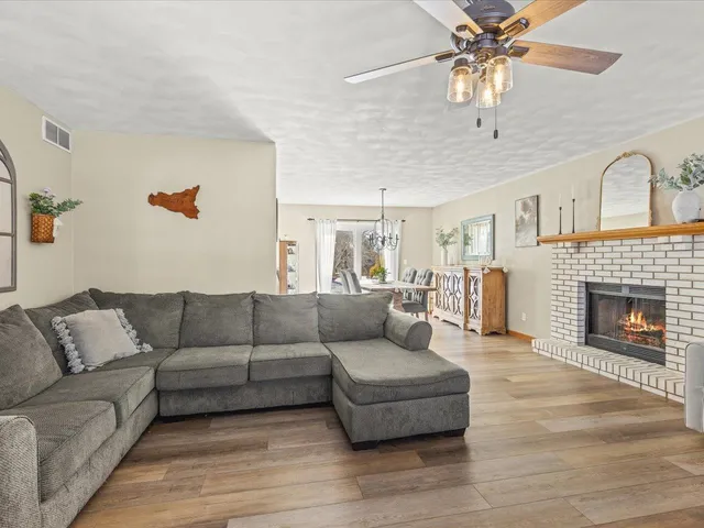 a bathroom with a sink a toilet and shower curtain