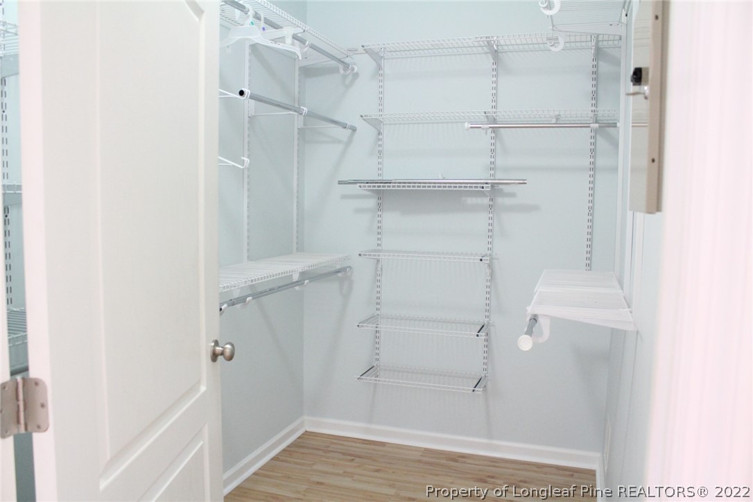1324 Kershaw Loop, Unit 206 Fayetteville, NC 28314 - Photo 4 of 18 a view of walk in closet with empty racks