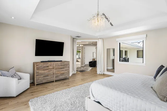 a bathroom with a tub shower and sink