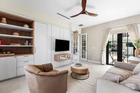 a room with furniture and a flat screen tv