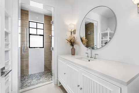 a bathroom with a shower and a tub