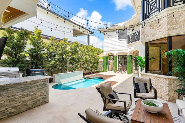 a kitchen with stainless steel appliances a sink and a refrigerator