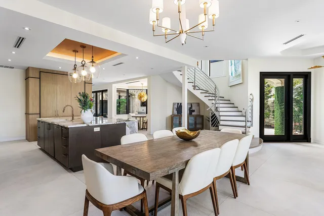 a kitchen with a potted plant on the counter and cabinets