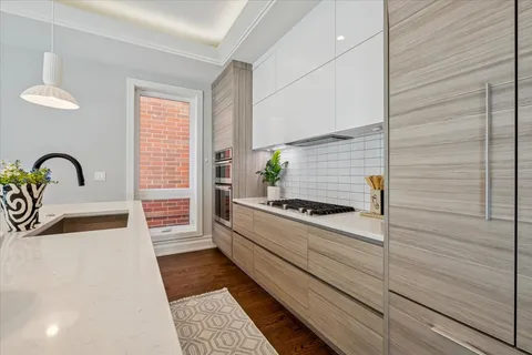 a kitchen with a sink and a stove