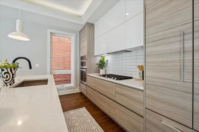 a kitchen with a sink and a stove