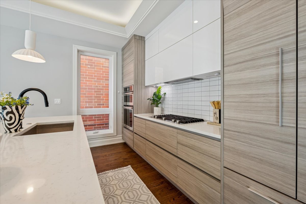 1448 West Chestnut Street, Unit 3 Chicago, IL 60642 - Photo 12 of 46 a kitchen with a sink and a stove