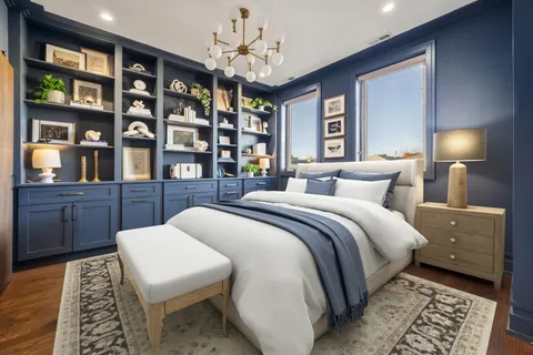 a bedroom with a bed and a book shelf