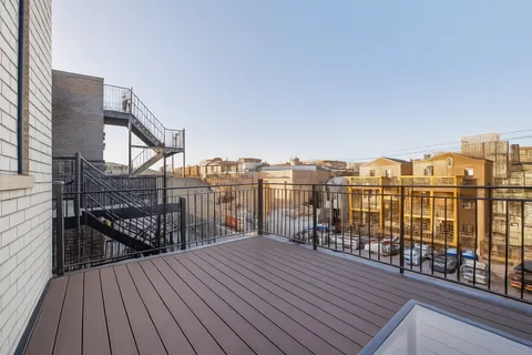 a view of roof deck with patio