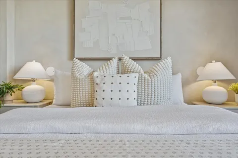 a bedroom with a bed and window