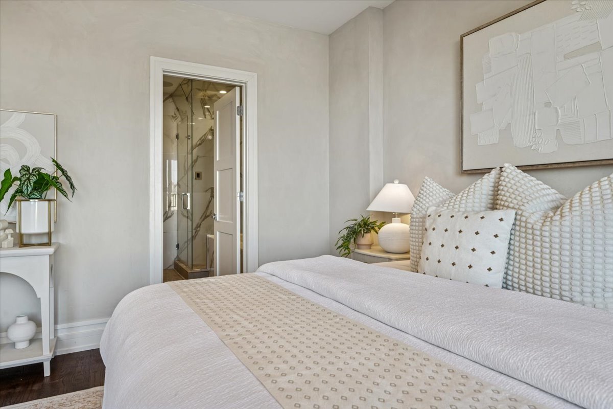 1448 West Chestnut Street, Unit 3 Chicago, IL 60642 - Photo 26 of 46 a bedroom with a bed and a potted plant