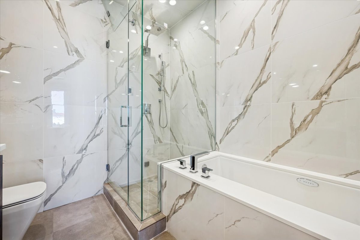 1448 West Chestnut Street, Unit 3 Chicago, IL 60642 - Photo 29 of 46 a bathroom with a bathtub and shower