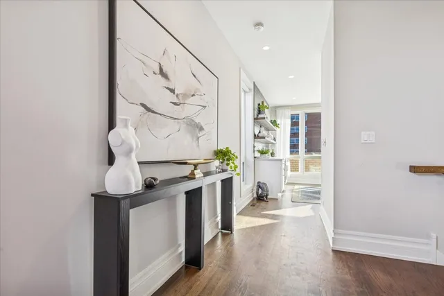 a view of a workspace with furniture and a potted plant