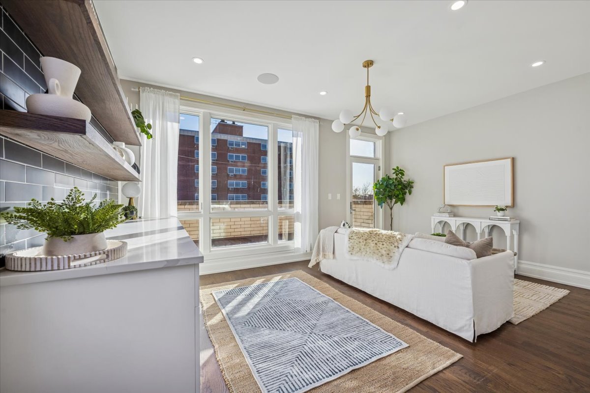 1448 West Chestnut Street, Unit 3 Chicago, IL 60642 - Photo 35 of 46 a living room with furniture and a large window