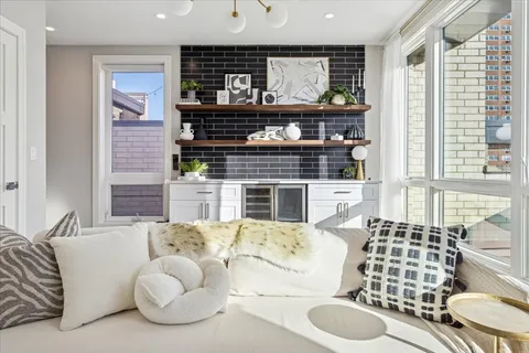 a kitchen with stainless steel appliances kitchen island granite countertop a stove and cabinets
